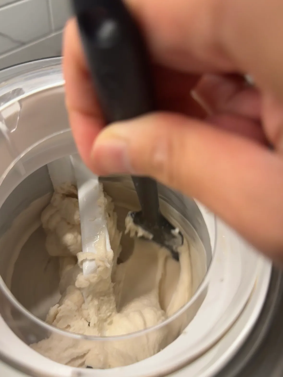 Manually churching the ice cream within the machine promotes more contact with the ice bowl, thickening ice cream texture.
